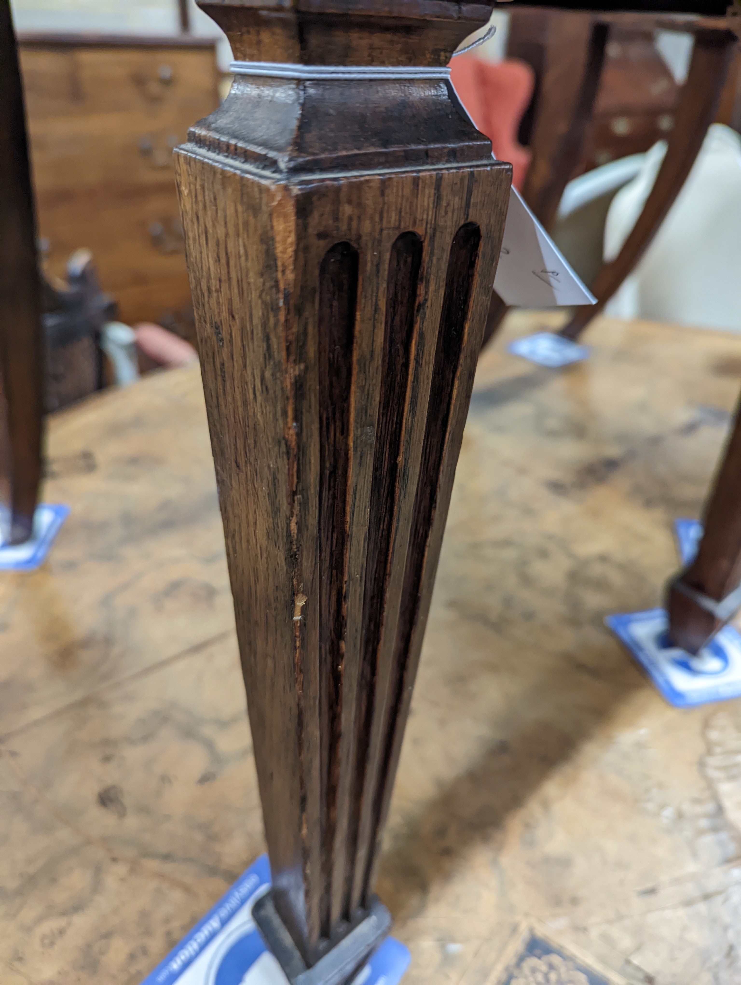 A pair of Victorian oak hall chairs with painted armorials, width 43cm, depth 39cm, height 94cm